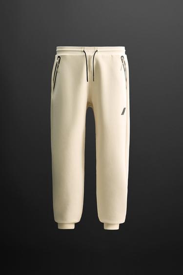 TECHNICAL JOGGERS WITH ZIPS - CITRIC 