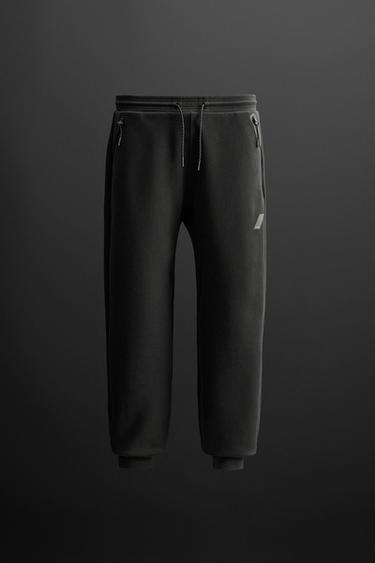 TECHNICAL JOGGERS WITH ZIPS - CITRIC 